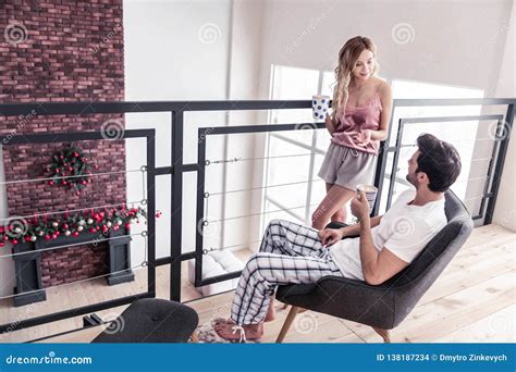 Slim Blond Long Haired Woman In A Nice Lingerie Talking To Her Husband Stock Photo Image Of
