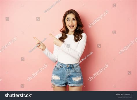 Cute Smiling Brunette Girl Showing Advertisement Stock Photo Shutterstock
