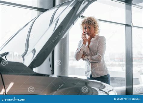 Vehicle Breakdown Woman With Curly Blonde Hair Is In Autosalon Stock Image Image Of Human