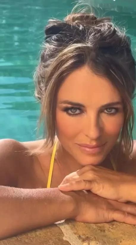Liz Hurley 59 Dazzles In Tiny Yellow Bikini As She Splashes In The Sea In New Video Daily Star