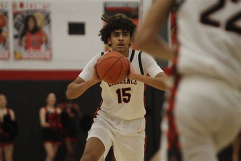 Lawrence boys, girls basketball teams drop home games against Olathe