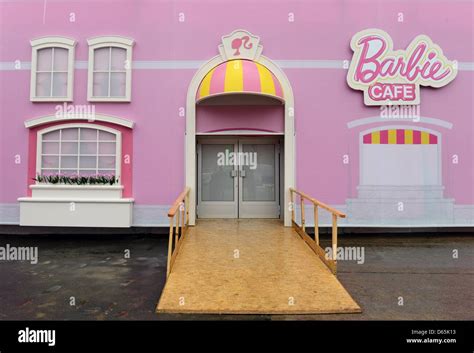 'Barbie Cafe' is written next to the entrance to the'Barbie Dreamhouse ...
