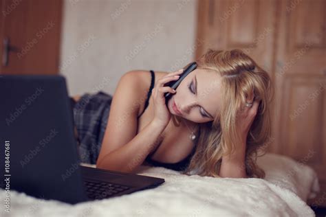 Sexy Blonde Woman With Laptop Calling Stock Photo Adobe Stock