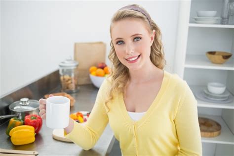 Premium Photo Smiling Cute Blonde Holding A Mug