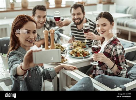 Positive Delighted Brunette Girl Taking Photo On Her Gadget Stock Photo Alamy