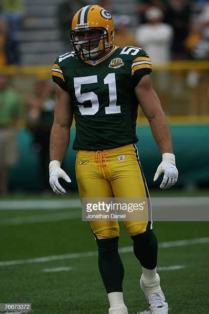 Brady Poppinga of the Green Bay Packers warms up before a game ...