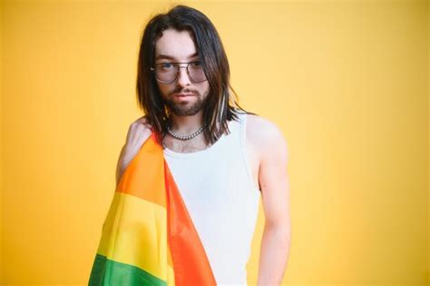 Premium Photo Happy Gay Man Having Fun Holding Rainbow Flag Symbol Of Lgbtq Community