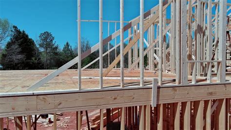 The Construction Of A Stick House Involves Assembling Timber Beams Into