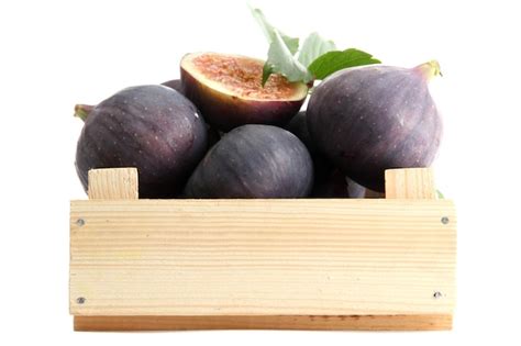 Premium Photo Ripe Sweet Figs With Leaves In Wooden Crate Isolated On