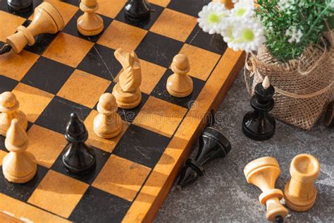 Chess Chess Board Chess Pieces And Flowers On A Gray Blue Background