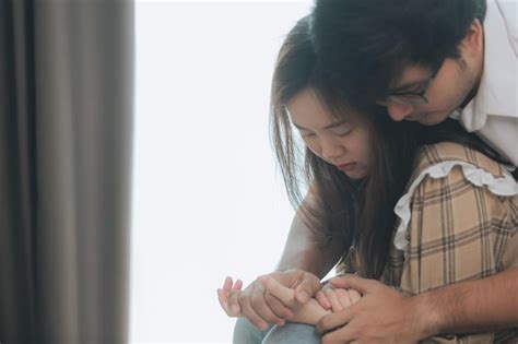 Premium Photo Young Man Comforting And Supporting A Sad Woman Who Is