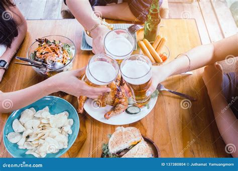 Two Asian Woman And One Mendrinking Beerare Smile Stock Photo Image