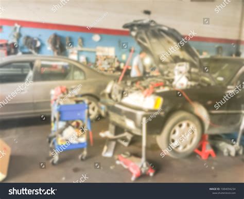 Blurred Motion Auto Mechanics Examining Fixing Stock Photo 1084094234