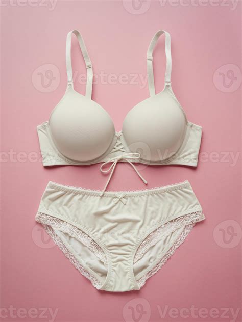 Elegant White Lingerie Set On Pastel Pink Background Featuring A Soft Cup Bra And Matching