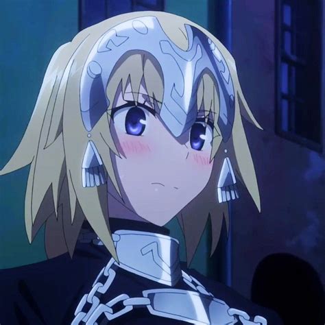 An Anime Character With Blonde Hair And Blue Eyes Wearing Chain Around
