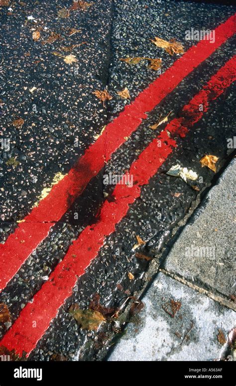 Double Red Lines At The Side Of The Road In London Means No Stopping At