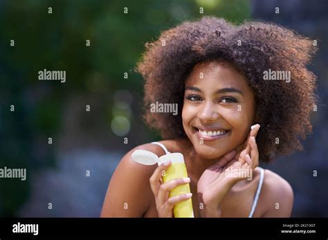 Applying Sunscreen Cropped Hi Res Stock Photography And Images Alamy