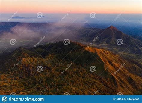 Aerial View Of Rock Cliff At Kawah Ijen Volcano With Turquoise Sulfur