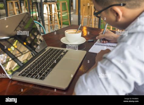 Side View Of Young Man Writing Diary Stock Photo Alamy