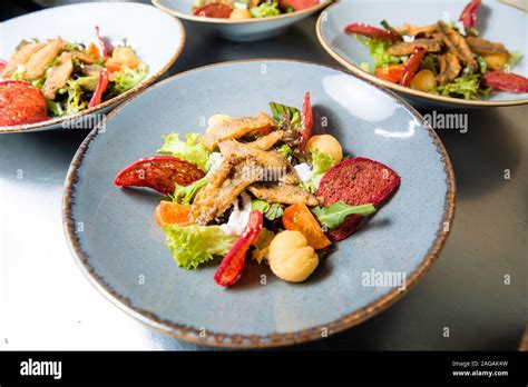 Salad With Fried Fish Fillet Red Mullet Tender Lamb Fillet Fried In