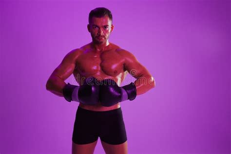 Man Bodybuilder Posing Muscles With Nude Fitness Torso Isolated On Black Background In Neon