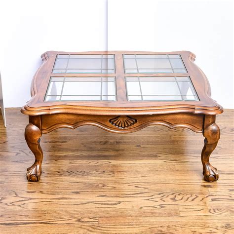 An Oak Finish Glass Top Coffee Table with Four Glass Inserts | EBTH