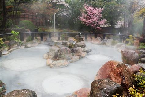 Oniishibozu Jigoku Hot Spring And Gas With Pink Cherry Tree Beppu Stock Photo Image Of Nature