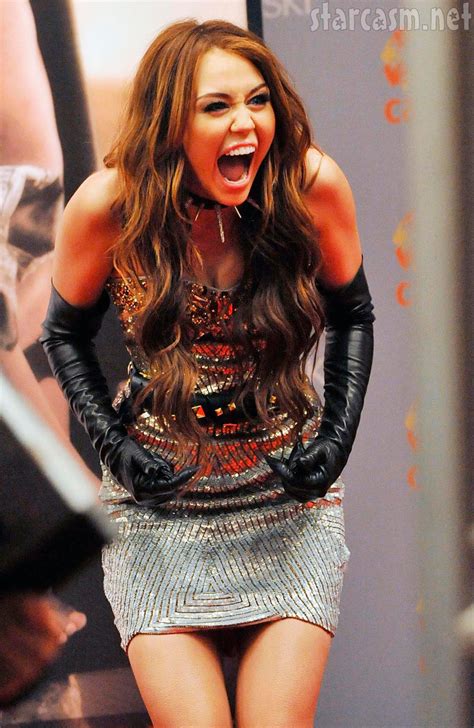 PHOTOS Miley Cyrus From Sex And The City In Mini Skirt And Spiked Collar Starcasm