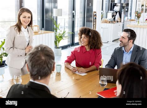 Female Professional Planning With Colleague In Meeting Stock Photo Alamy