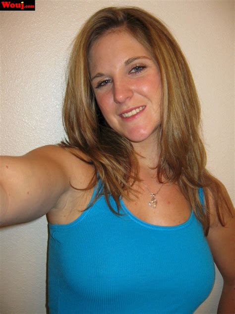 Desirable Brunette Girl Posing In Black Lingerie On The Couch Photos