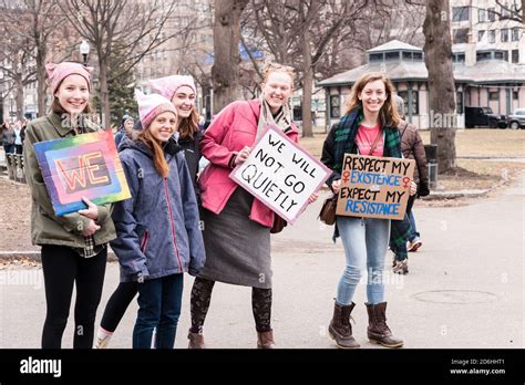 Group Of Five Women Wearing Pink Pussy Hats Posing With Their Signs At The Boston Women S March