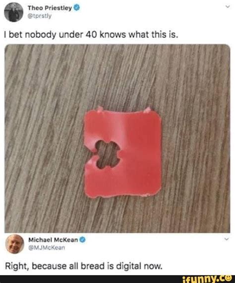 A Piece Of Red Paper That Has Been Cut In Half And Placed On Top Of A