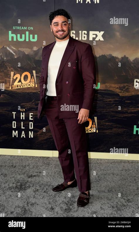 Actor E J Bonilla Poses At The Premiere Of The First Season Of The Fx Series The Old Man