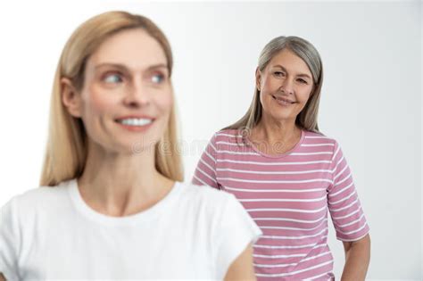 Blonde Cute Woman Smiling Nicely Her Mom Standing Behind Stock Image Image Of Casual