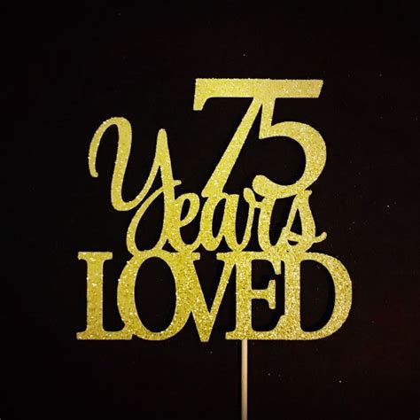 A Cake Topper That Says Years Loved On It With The Number In Gold