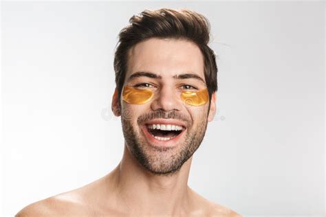 Photo Of Handsome Half Naked Man Looking At Camera And Holding Lemon