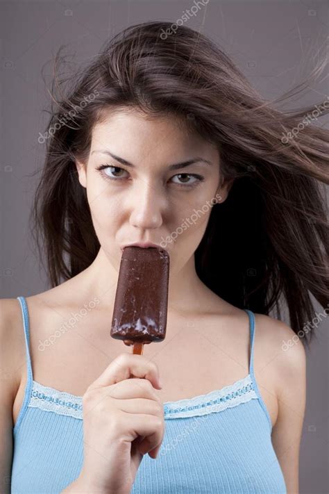 Sexy Brunette Woman Licking Chocolate Ice Cream Stock Photo By RVAS