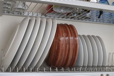 Lots Of Wet Dishes In The Dish Draining Closet Stock Photo Image Of