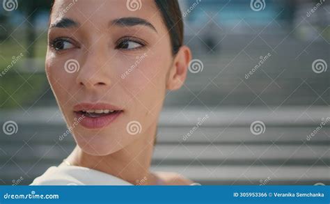 Portrait Delicate Brunette Girl With Refined Features Standing On Sunny Street Stock Photo