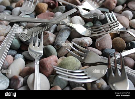 Identical Table Forks And Cake Forks From The Cutlery Set Lying On