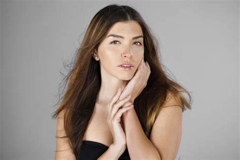 Sexy Blonde Woman In Black Dress Stock Photo By Arkusha 71396739