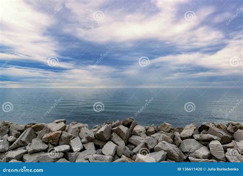 Sea Coast With Stone Dam Stock Photo Image Of Blue 136611420
