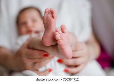 Baby Legs Mothers Hands Stock Photo 750384712 Shutterstock