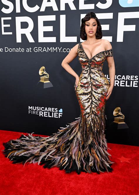 Cardi B Shines in Gold Roberto Cavalli Dress With Wild Twist for