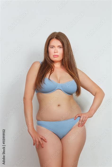 Portrait Of Beautiful Fat Woman In Lingerie Or Underwear Posing In