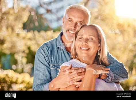 Mature Couple Hug And Bonding In Nature Park Environment Garden Or Backyard For Interracial