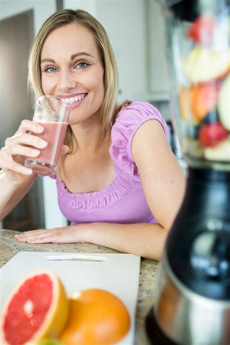 Pretty Blonde Woman Drinking Her Homemade Smoothie Stock Photo Image Of Eating Board