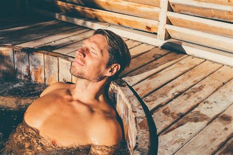 Premium Photo Man Relaxing In Wooden Hot Tub Outdoor