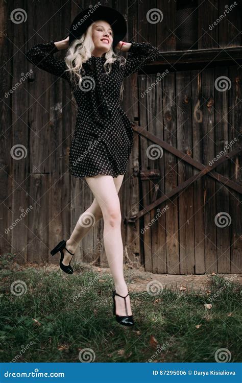 Beautiful Attractive And Stylish Girl Wearing Black Hat Jumping Posing In City Nude Makeup