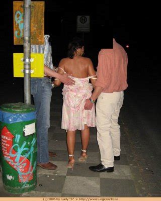Busty German Lady Jerking Off Two Lucky Guys In Public Porn Pictures